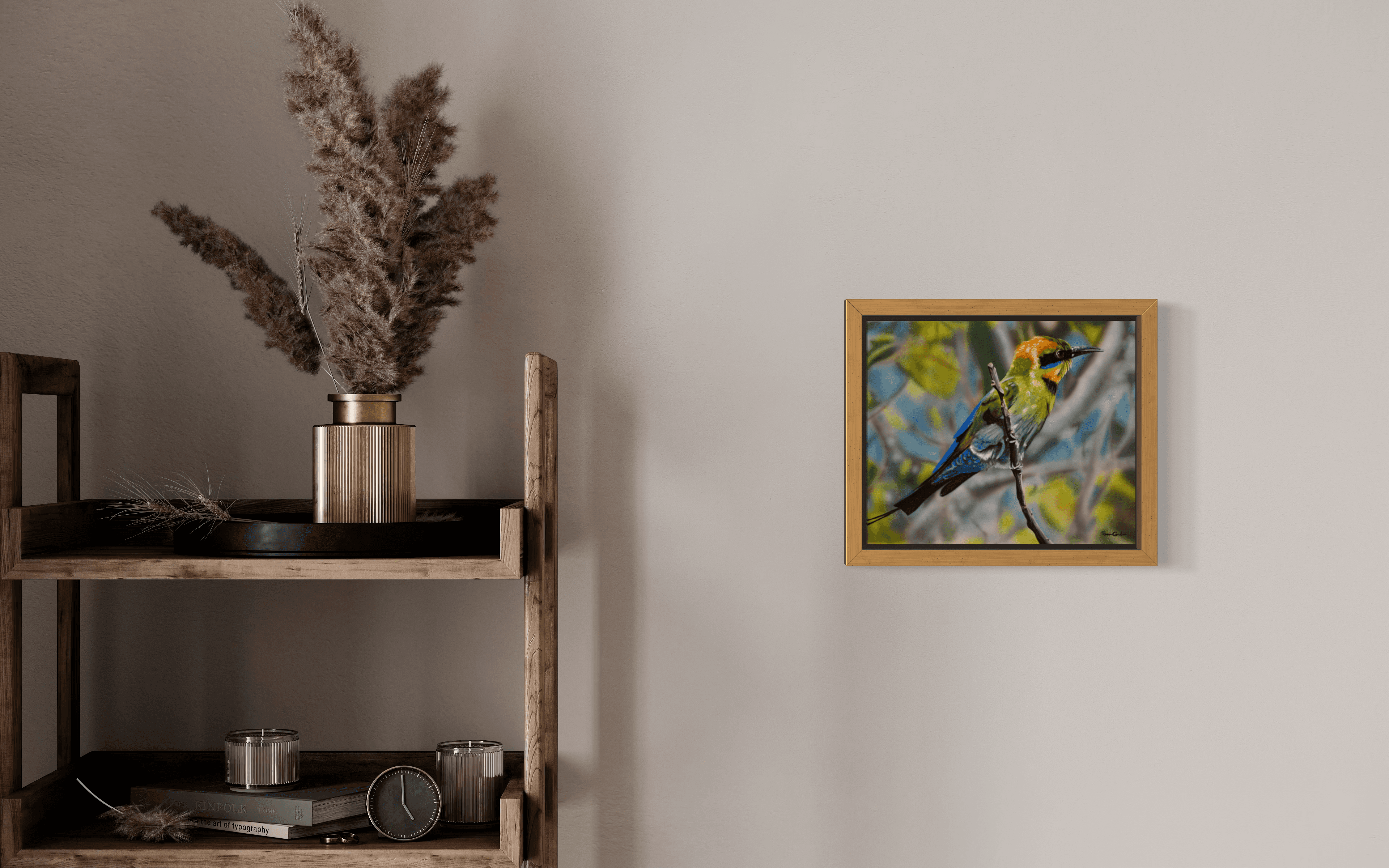 Minimalist wooden shelf with pampas grass beside a framed painting of a colorful bird.